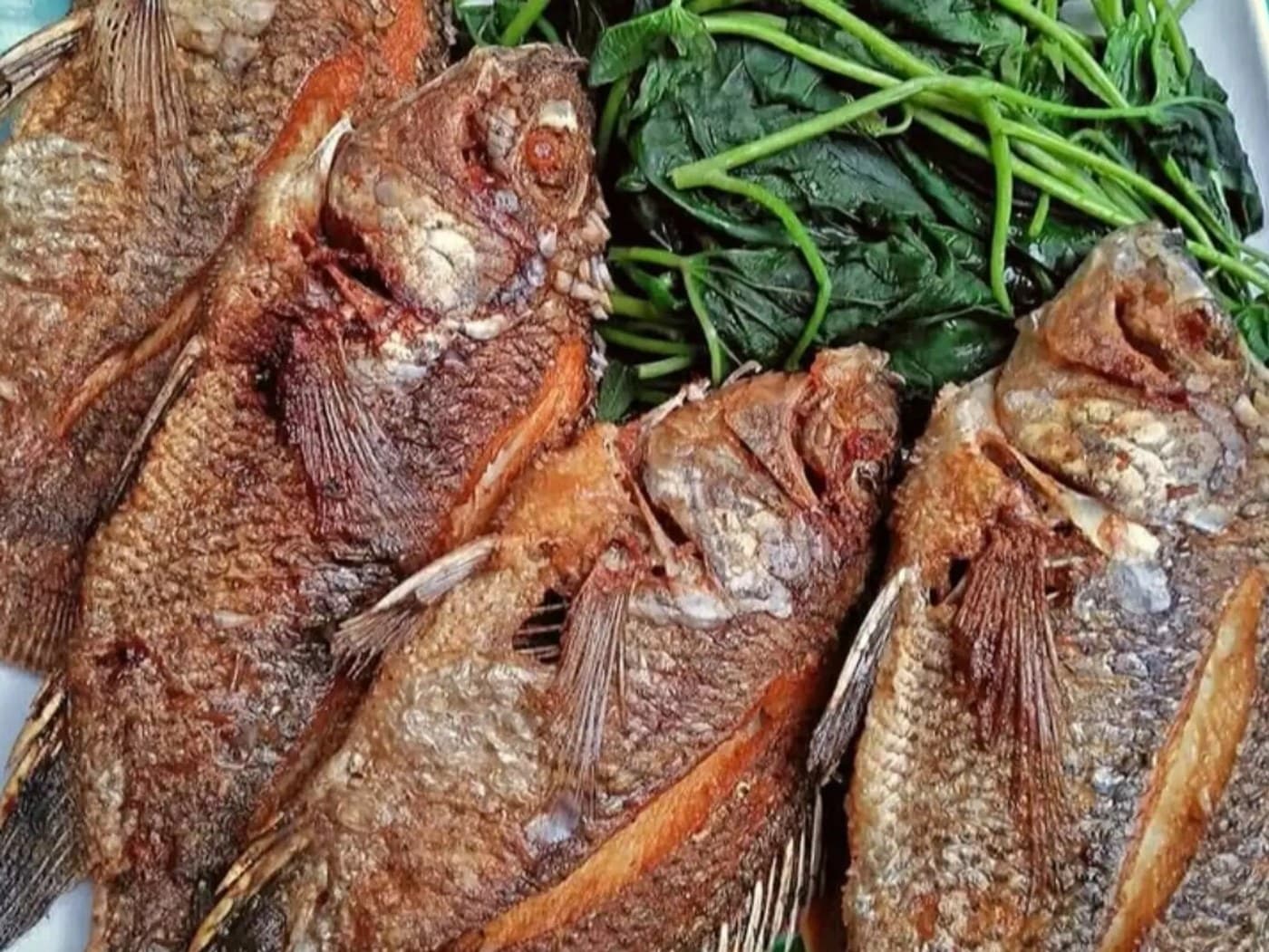 Tilapia (1 ) with kamote leaves